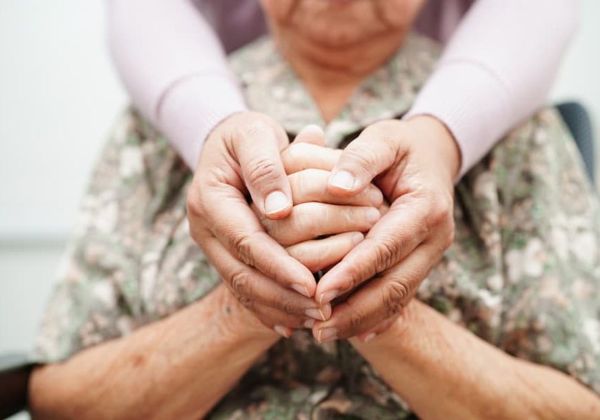 caregiver-holding-hands-asian-elderly-woman-patient-help-and-care-in-hospital